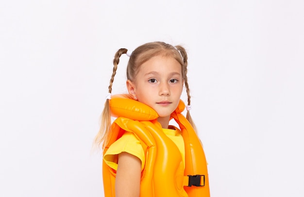 Portrait of smiling little girl in lifejacket