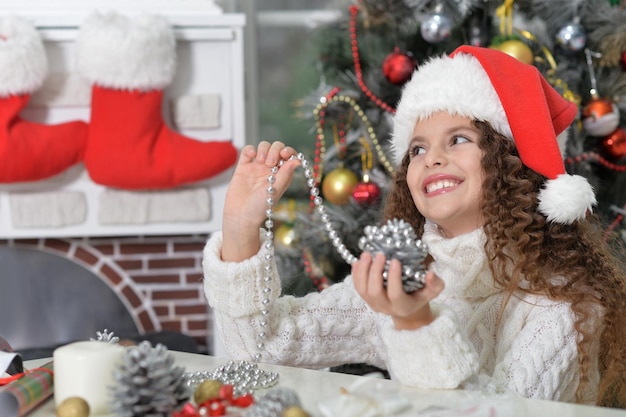 Portrait of smiling little girl preparing for Christmas