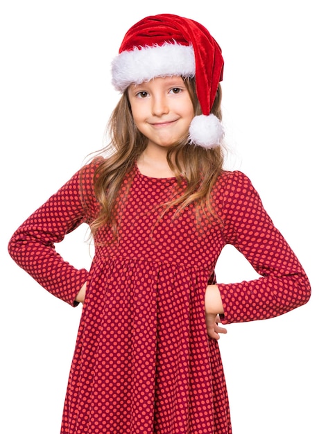 Portrait of smiling little girl with Santa Claus hat Holiday Christmas concept happy cute child isolated on white background