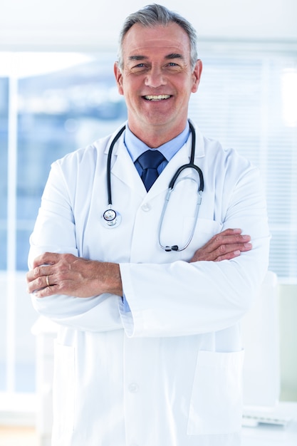 Portrait of smiling male doctor in hospital