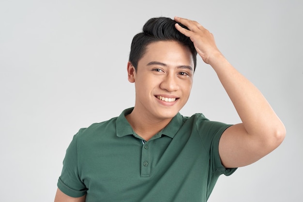 Portrait of smiling man showing his healthy hair