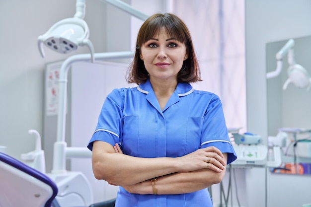 Portrait of smiling nurse looking at camera in dentistry