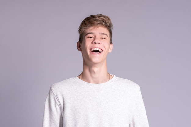 Portrait of smiling teenager guy