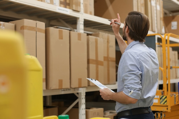 Portrait of a smiling warehouse keeper at work.