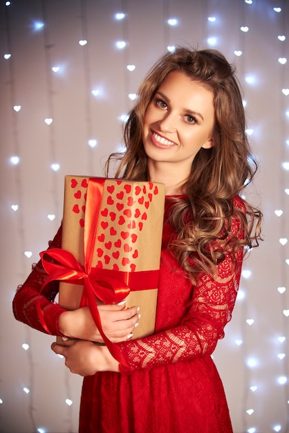 Portrait of smiling woman holding a gift