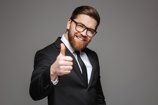 Portrait of a smiling young businessman dressed in suit