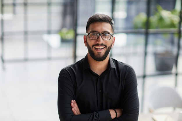 Portrait of smiling young businessman in office