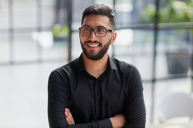 Portrait of smiling young businessman in office