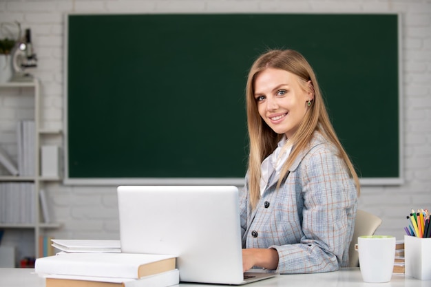 Portrait of smiling young college student studying in classroom Webinar elearning at school distance education