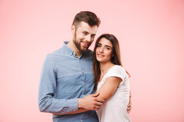 Portrait of a smiling young couple hugging