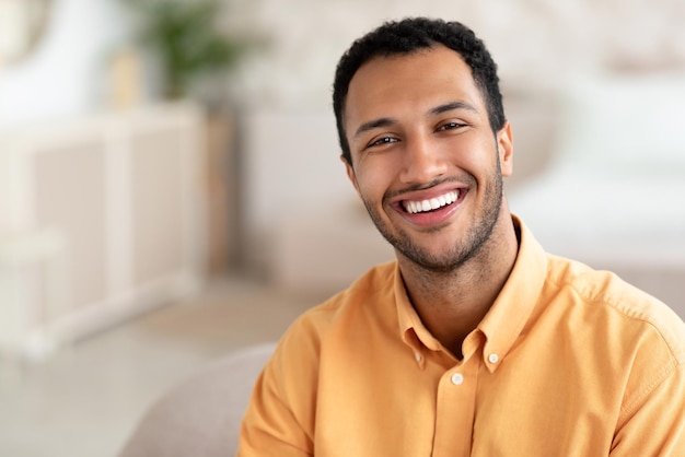 Portrait of smiling young man posing at camera