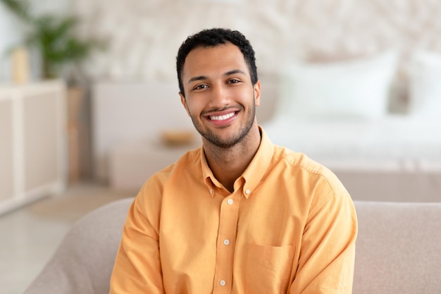 Portrait of smiling young man posing at camera