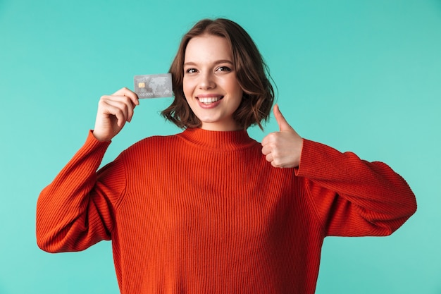 Portrait of a smiling young woman dressed in sweater