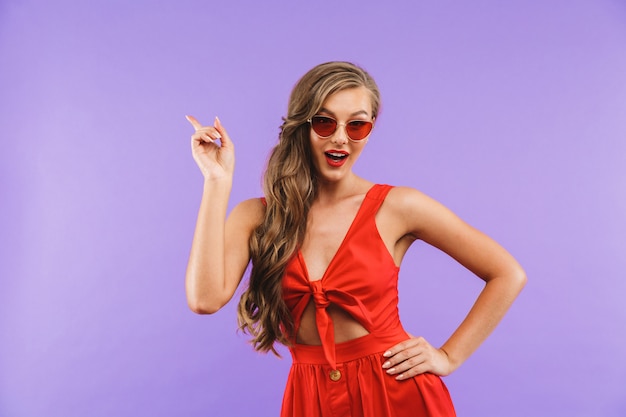 Portrait of a smiling young woman in red dress