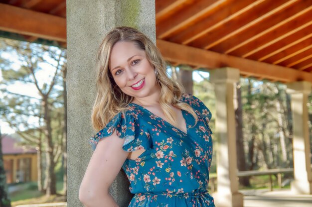 Portrait of smiling young woman standing outdoors