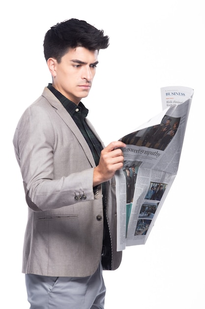 Photo portrait snap figure, caucasian business man stand in suit dark green shirt gray pants, he has confident and read paper english newspaper over white background isolated