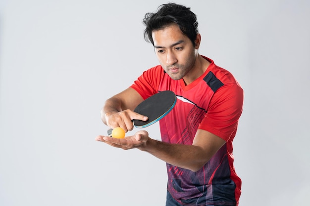 Portrait of sports man male athlete playing table tennis isolated