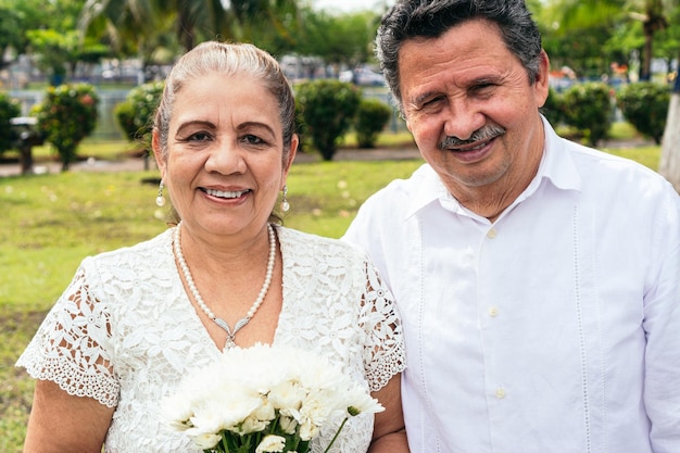 Portrait of Spouses in the open air smiling