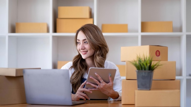 Portrait of Starting small businesses SME owners female entrepreneurs working on receipt box and check online orders to prepare to pack the boxes sell to customers sme business ideas online