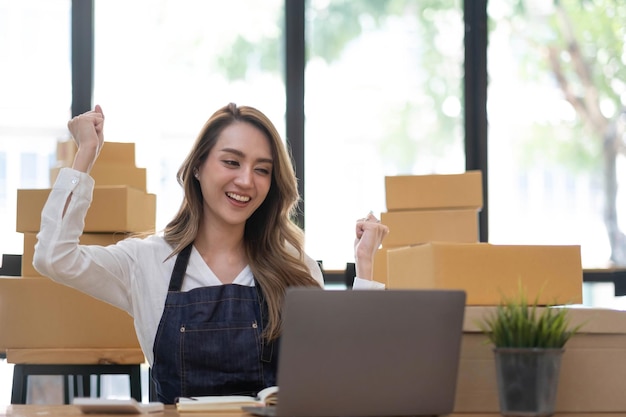 Portrait of Starting small businesses SME owners female entrepreneurs working on receipt box and check online orders to prepare to pack the boxes sell to customers SME business ideas online