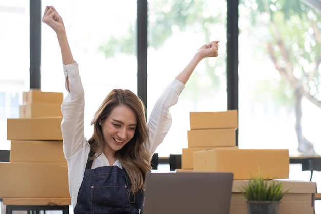 Portrait of Starting small businesses SME owners female entrepreneurs working on receipt box and check online orders to prepare to pack the boxes sell to customers SME business ideas online