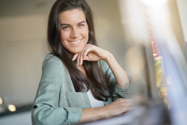  Portrait of striking brunette at home                    