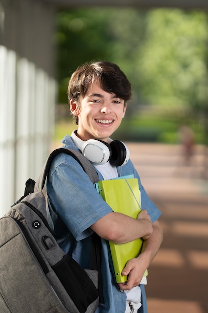 Portrait of student boy smiling and looking at camera