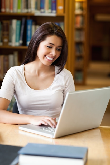 Portrait of a student working with a laptop