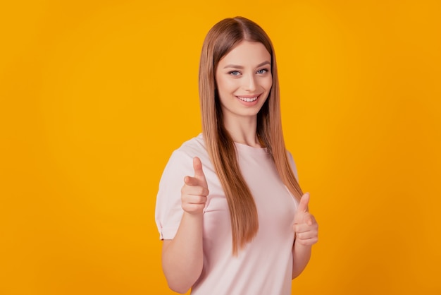 Portrait of stunning blonde lady indicate fingers camera choose you on yellow background