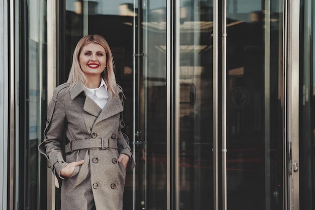 Portrait stylish businesswoman outdoors in business district