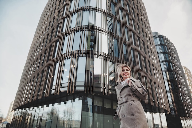 Portrait stylish businesswoman outdoors in business district