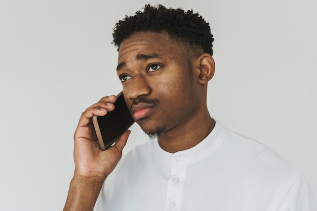 Portrait of stylish man talking on smartphone