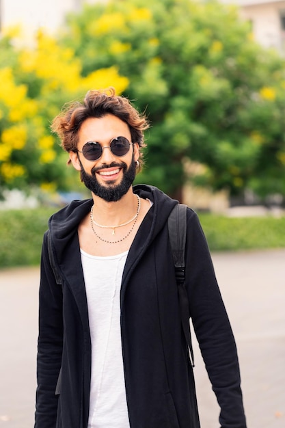 Portrait of a stylish young man smiling happy