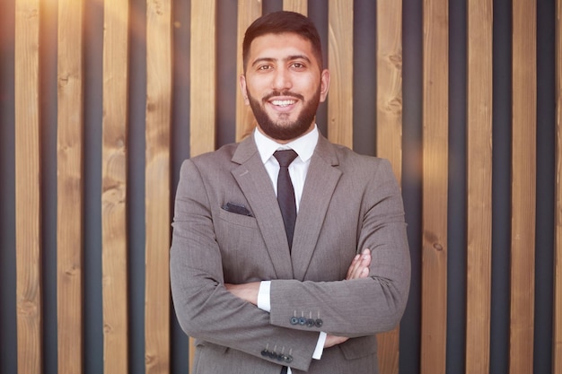 Portrait of successful young businessman in office