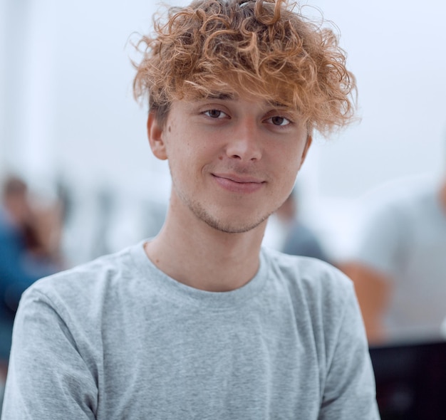 Portrait of a successful young man on an office background