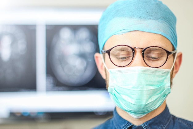 Portrait of a surgeon doctor in uniform at the medical office