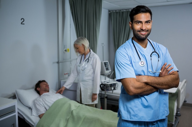 Portrait of surgeon standing in ward