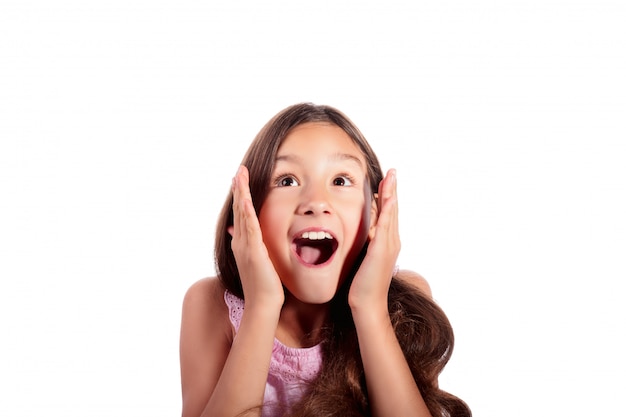 Portrait of surprised, excited, shocked teenage girl looking up isolated on white