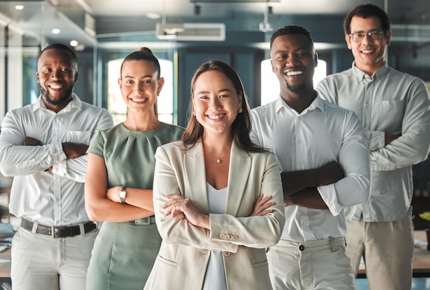 Portrait of team posing in the office in a business meeting and smiling Professional ceo management and employees showing good teamwork with diverse young and multiracial workers