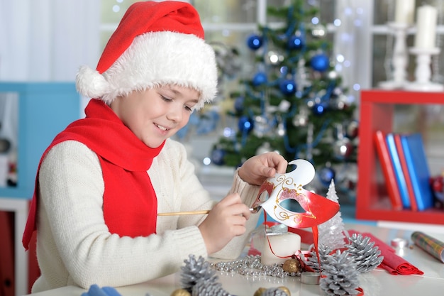 Portrait of teen boy preparing for Christmas at home