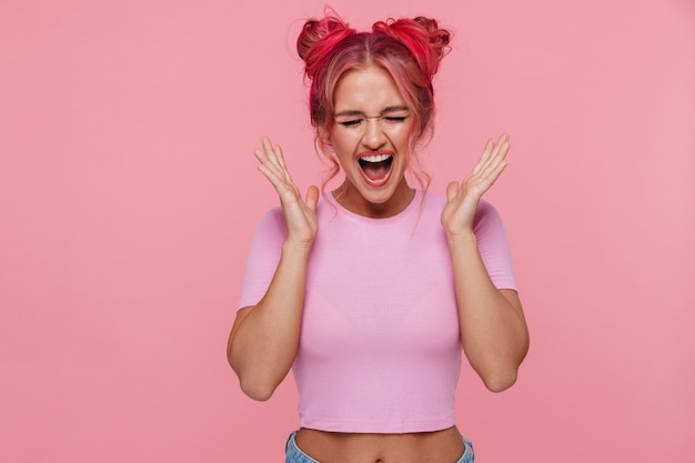 Portrait of terrified young woman with colorful hairstyle screaming in panic