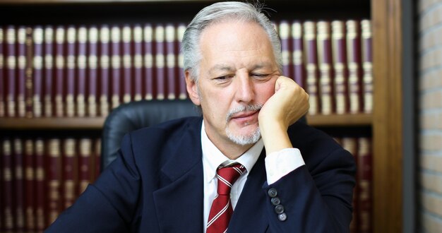 Portrait of a thoughtful manager in his office