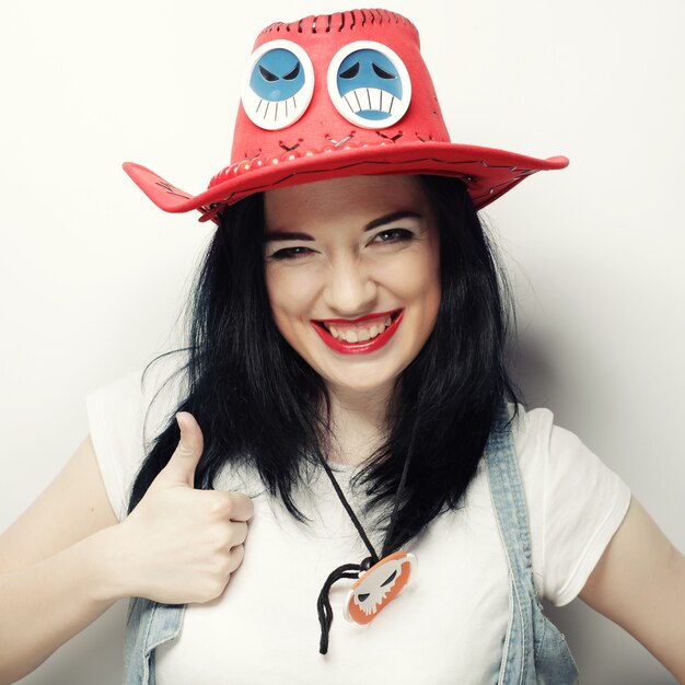 Portrait of Trendy Hipster Girl in Red Hat 