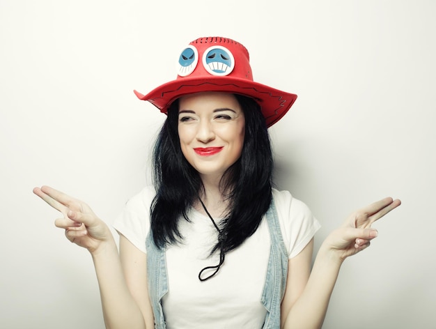 Portrait of Trendy Hipster Girl in Red Hat