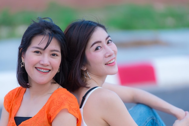 Portrait of two beautiful asian womenLifestyle of modern girlImage of young happy femaleDear friends are together on weekends to relax