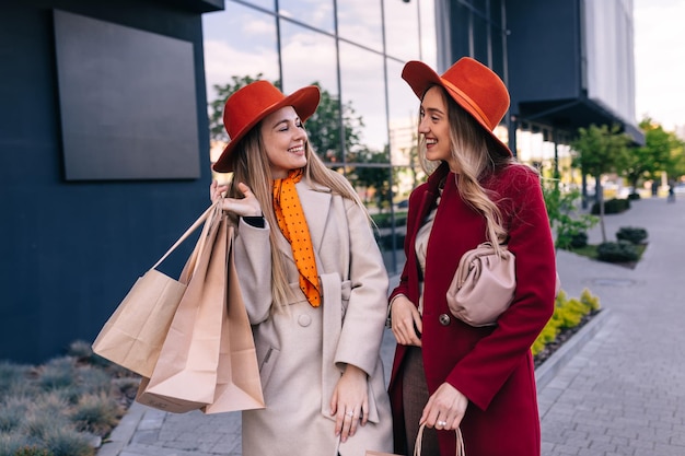 Portrait of two friends shopping together