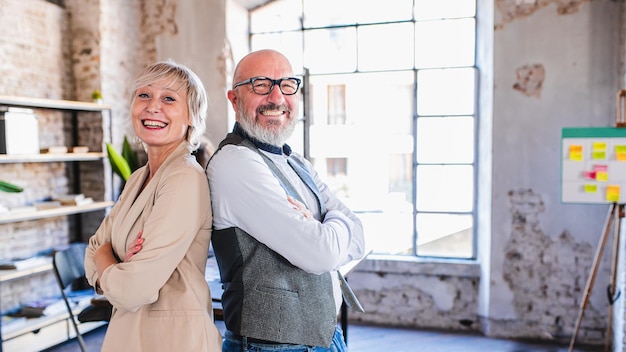 Portrait of two happy and smiling colleagues at work concept of creative team designers and architects copy space an 169 format