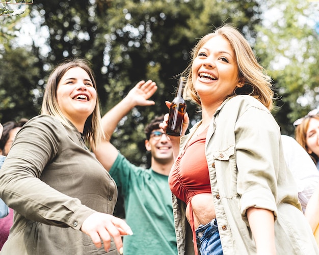 Portrait of two young curvy happy women at a dancing party message of body positivity