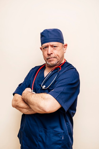  portrait of a veteran doctor in an operating room suit