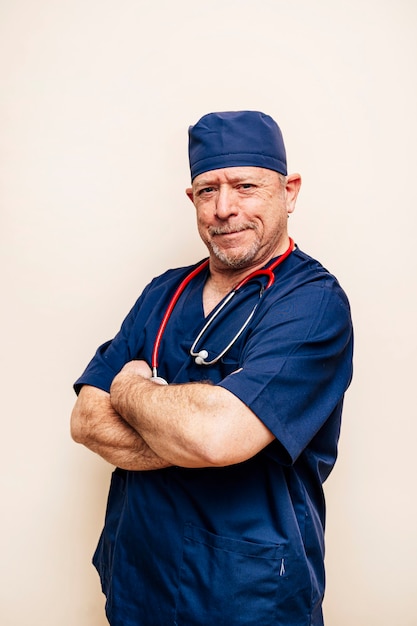  portrait of a veteran doctor in an operating room suit